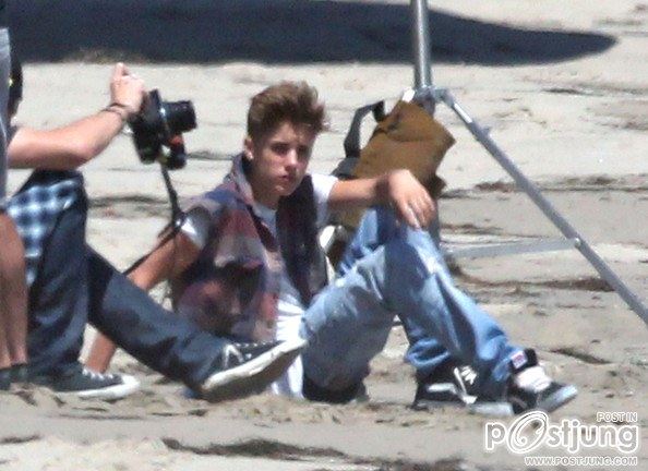 Justin Bieber poses for a photoshoot on the beach in Malibu
