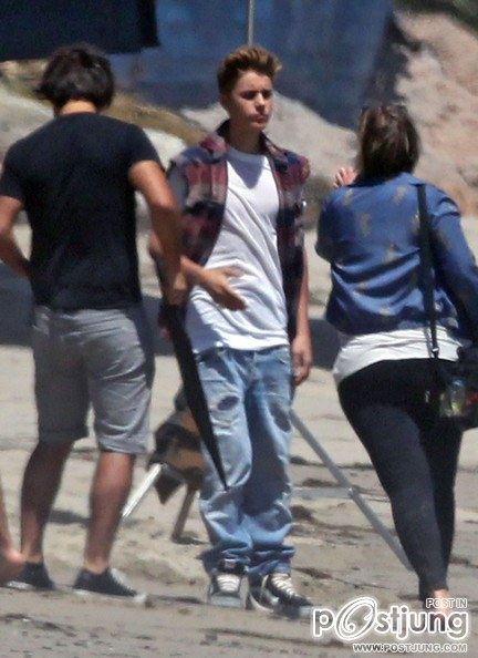 Justin Bieber poses for a photoshoot on the beach in Malibu