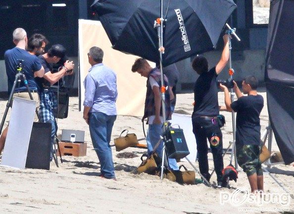 Justin Bieber poses for a photoshoot on the beach in Malibu