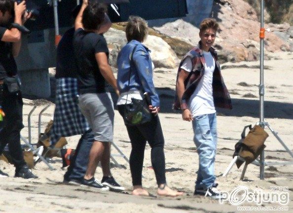 Justin Bieber poses for a photoshoot on the beach in Malibu