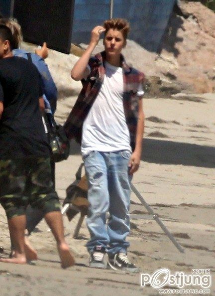 Justin Bieber poses for a photoshoot on the beach in Malibu