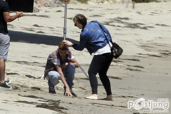 Justin Bieber poses for a photoshoot on the beach in Malibu