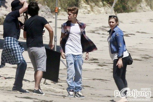 Justin Bieber poses for a photoshoot on the beach in Malibu