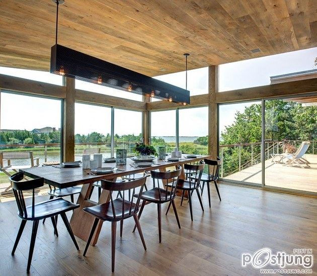 Earthy Timber Clad Interiors vs. Urban Glass Exteriors: Cottage Design by Bates Masi Architects