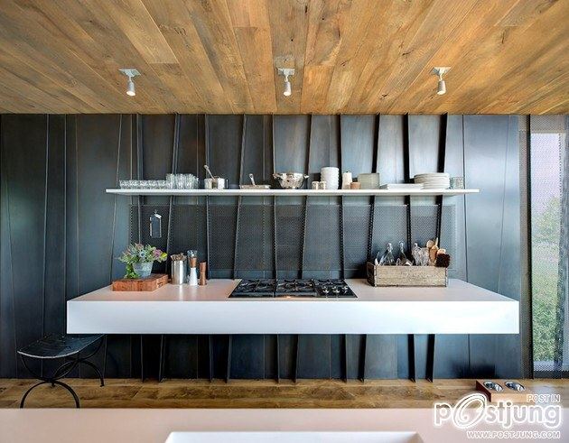 Earthy Timber Clad Interiors vs. Urban Glass Exteriors: Cottage Design by Bates Masi Architects