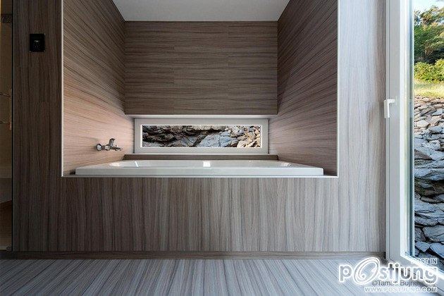 Timber Cabin Built into Cliff Side Site