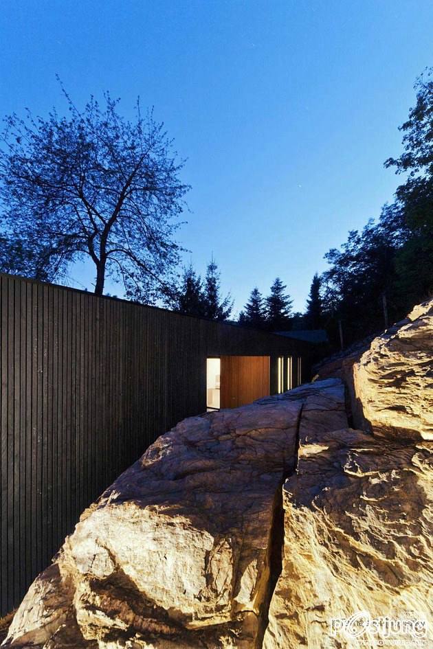 Timber Cabin Built into Cliff Side Site