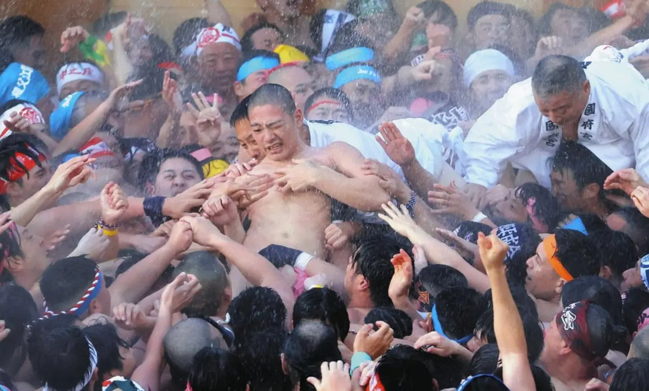 Touching the body of a chosen man at a naked festival in Japan will ward off bad luck.